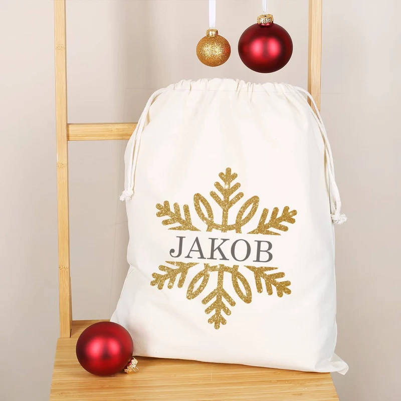 Geschenksack zu Weihnachten mit Schneeflocke in Goldoptik und Name bedruckt