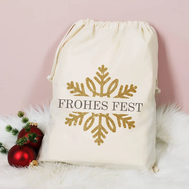 Geschenksack zu Weihnachten mit Schneeflocke in Goldoptik und Name bedruckt