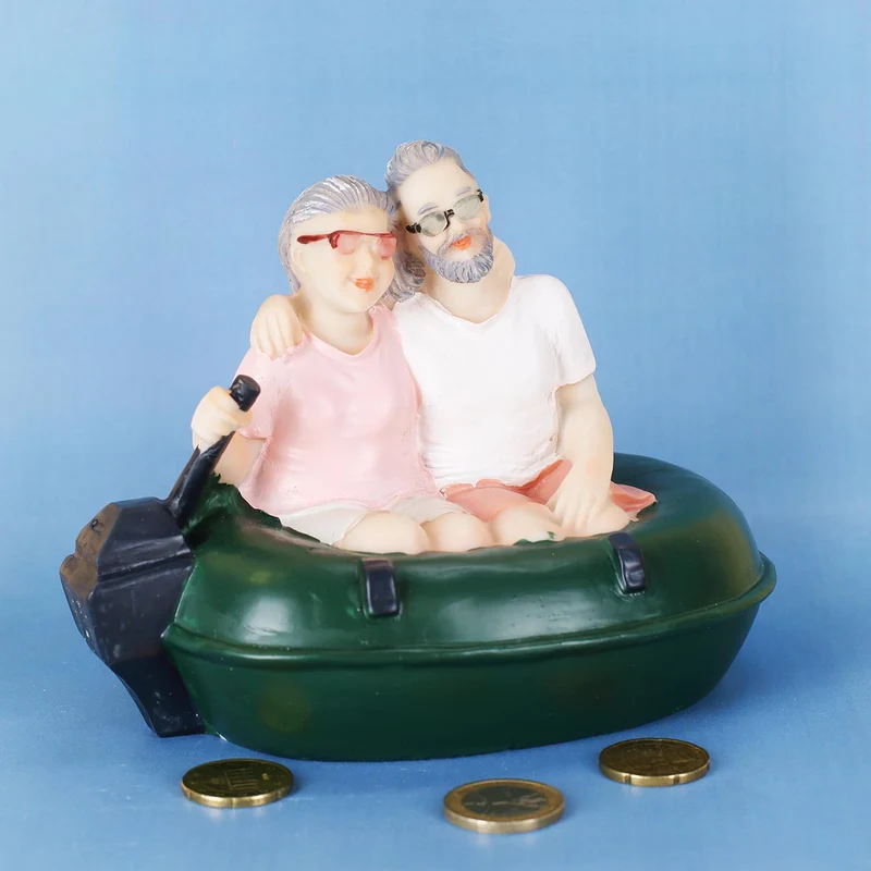 Spardose Älteres Pärchen im Gummiboot